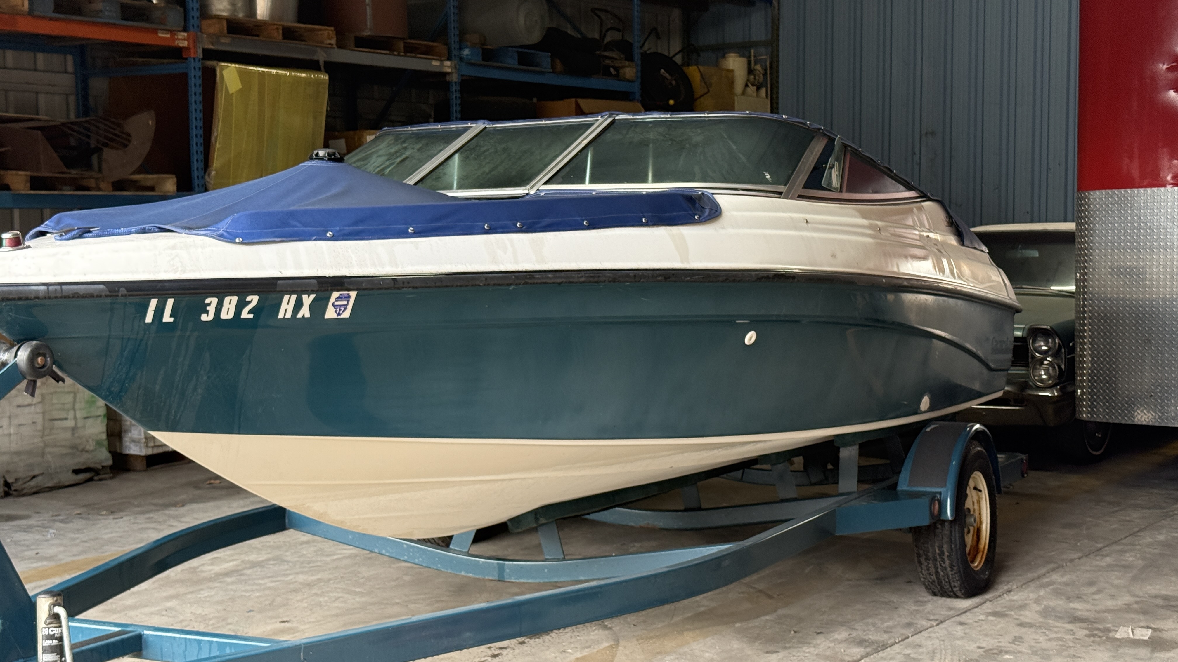 Boat before detailing — dull oxidized hull
